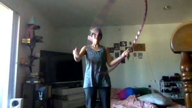 A Person Stands In A Bedroom With Arms